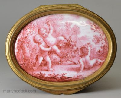 French enamel table snuff box the lid painted with bacchanalian boys in pink, circa 1840