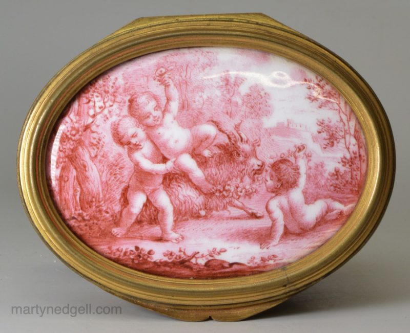 French enamel table snuff box the lid painted with bacchanalian boys in pink, circa 1840