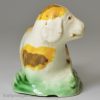 Small creamware pottery model of a dog decorated with colours under the glaze, circa 1790