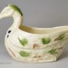 Creamware pottery duck sauce boat decorated with coloured splashes under the glaze, circa 1780