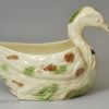 Creamware pottery duck sauce boat decorated with coloured splashes under the glaze, circa 1780