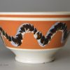Mochaware bowl decorated with a snail trail in slip, circa 1830