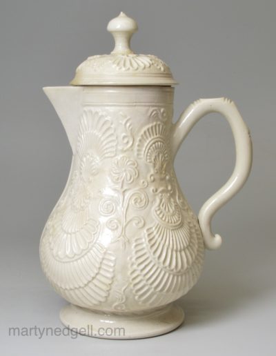 Staffordshire white saltglaze stoneware pectin shell moulded jug and cover, circa 1760