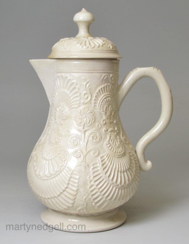 Staffordshire white saltglaze stoneware pectin shell moulded jug and cover, circa 1760