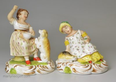 Pair of derby porcelain figures of girls with their pets, circa 1820