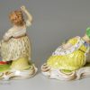 Pair of derby porcelain figures of girls with their pets, circa 1820