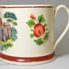 Creamware pottery mug decorated with a print of a drinking scene and coloured over the glaze, circa 1820