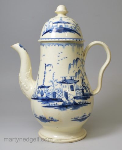 Creamware pottery coffee pot decorated in blue under the glaze, circa 1790