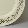 English creamware pottery plate with a pierced border, circa 1780