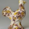 Pearlware pottery model of a chicken decorated with colours under the glaze, circa 1800