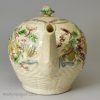 Creamware pottery teapot moulded with flowers and decorated with colours under the glaze, circa 1770 William Greatbatch Pottery Staffordshire