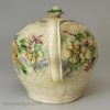Creamware pottery teapot moulded with flowers and decorated with colours under the glaze, circa 1770 William Greatbatch Pottery Staffordshire