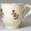 Creamware pottery coffee cup and saucer decorated with enamels over the glaze, circa 1780, probably Leeds Pottery