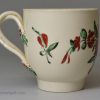 Creamware pottery coffee cup and saucer decorated with enamels over the glaze, circa 1780, probably Leeds Pottery