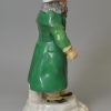 Staffordshire porcelain model of a Jewish pedlar or money changer, circa 1820