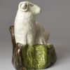 Pearlware pottery sheep and lamb decorated with colours under the glaze, circa 1800