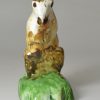 Pearlware pottery figure of a squirrel decorated with colours under the glaze, circa 1800