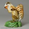 Pearlware pottery figure of a squirrel decorated with colours under the glaze, circa 1800