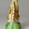 Pearlware pottery figure of a squirrel decorated with colours under the glaze, circa 1800