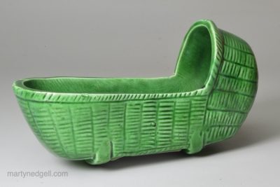 Green glazed pottery toy cradle, circa 1820
