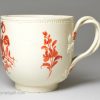 Creamware coffee cup and saucer decorated with enamels over the glaze, circa 1780