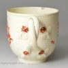 Creamware coffee cup and saucer decorated with enamels over the glaze, circa 1780