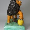 Staffordshire prattware pottery lion, circa 1800