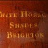 Large Sussex redware flagon 'WHITE HORSE SHADES BRIGHTON' inlaid in yellow slip, circa 1800