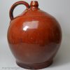 Large Sussex redware flagon 'WHITE HORSE SHADES BRIGHTON' inlaid in yellow slip, circa 1800