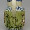 Pearlware pottery jug moulded with the Vicar, Sexton and Clerk decorated with colours under the glaze, circa 1800