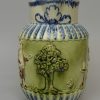 Pearlware pottery jug moulded with the Vicar, Sexton and Clerk decorated with colours under the glaze, circa 1800