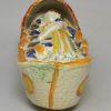 Large prattware pottery sleeping child in a cradle, circa 1820