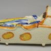 Large prattware pottery sleeping child in a cradle, circa 1820