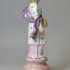Pearlware pottery figure of Summer decorated with overglaze enamels, circa 1820