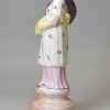 Pearlware pottery figure of Summer decorated with overglaze enamels, circa 1820