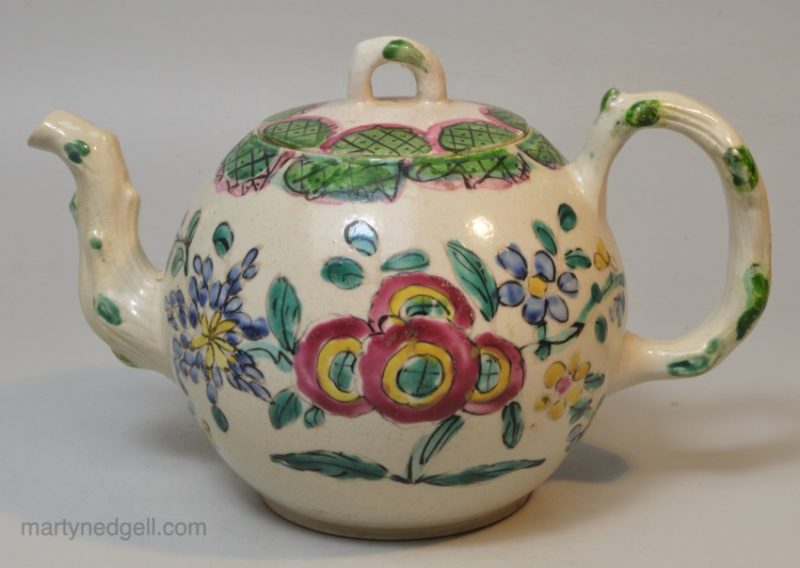 Staffordshire white salt glaze teapot decorated with enamels, circa 1760