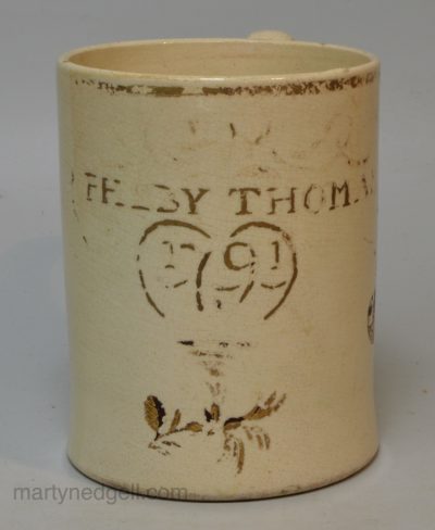 Creamware pottery mug 'PHEBY THOMAS 1791'