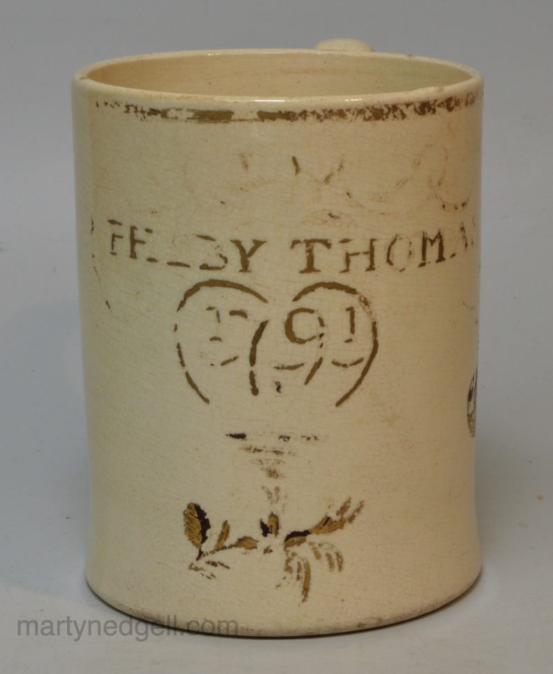 Creamware pottery mug 'PHEBY THOMAS 1791'