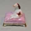 Staffordshire porcelain spaniel on a cushion, circa 1830