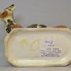Creamware pottery cow creamer decorated with colours under the glaze, circa 1820