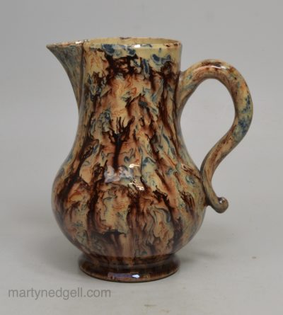 Solid agateware jug, circa 1760 interior covered in cream slip