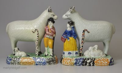 Pair of Yorkshire type prattware pottery sheep with attendants, circa 1820