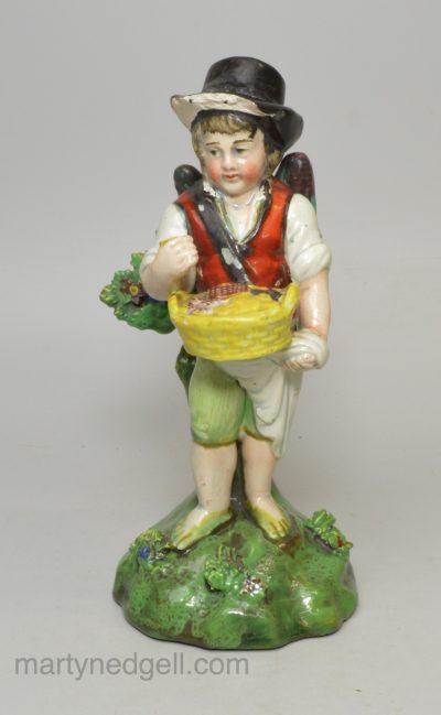 Staffordshire pearlware pottery figure of a boy with wings, circa 1820