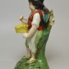 Staffordshire pearlware pottery figure of a boy with wings, circa 1820