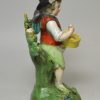 Staffordshire pearlware pottery figure of a boy with wings, circa 1820