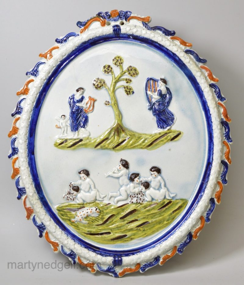 Large prattware pottery plaque moulded with classical figures, circa 1820