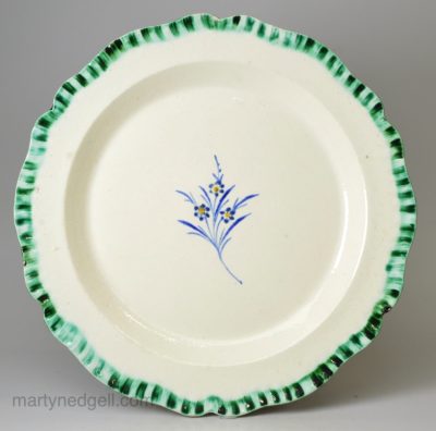 Creamware pottery plate with rudimentary shell edge border, circa 1800, Wood family Staffordshire