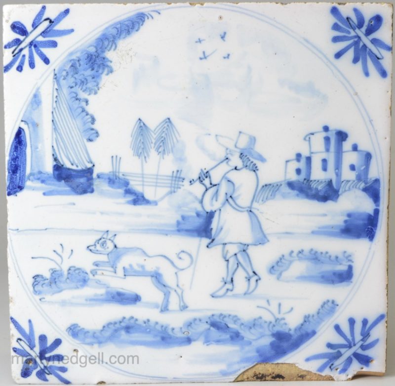 Bristol Delft tile painted with a man smoking and his dog, circa 1740