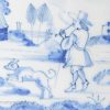 Bristol Delft tile painted with a man smoking and his dog, circa 1740