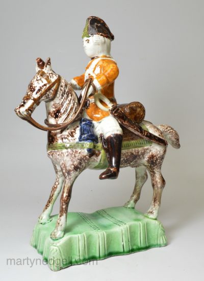 Staffordshire pottery figure of a Hussar on horseback decorated with enamels under the glaze, circa 1760